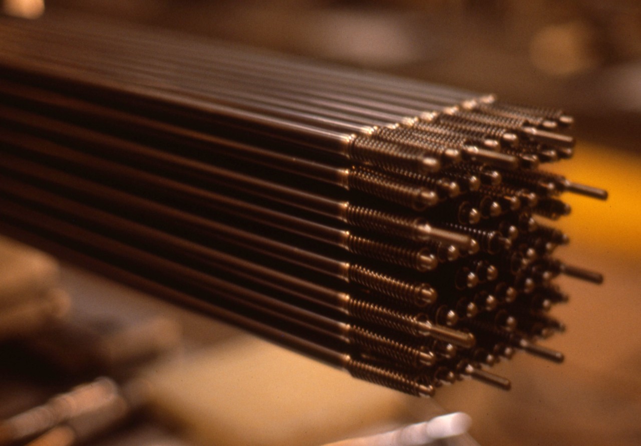 A fuel rod assembly is shown in close-up, highlighting key components behind innovation in nuclear energy technology and power generation.